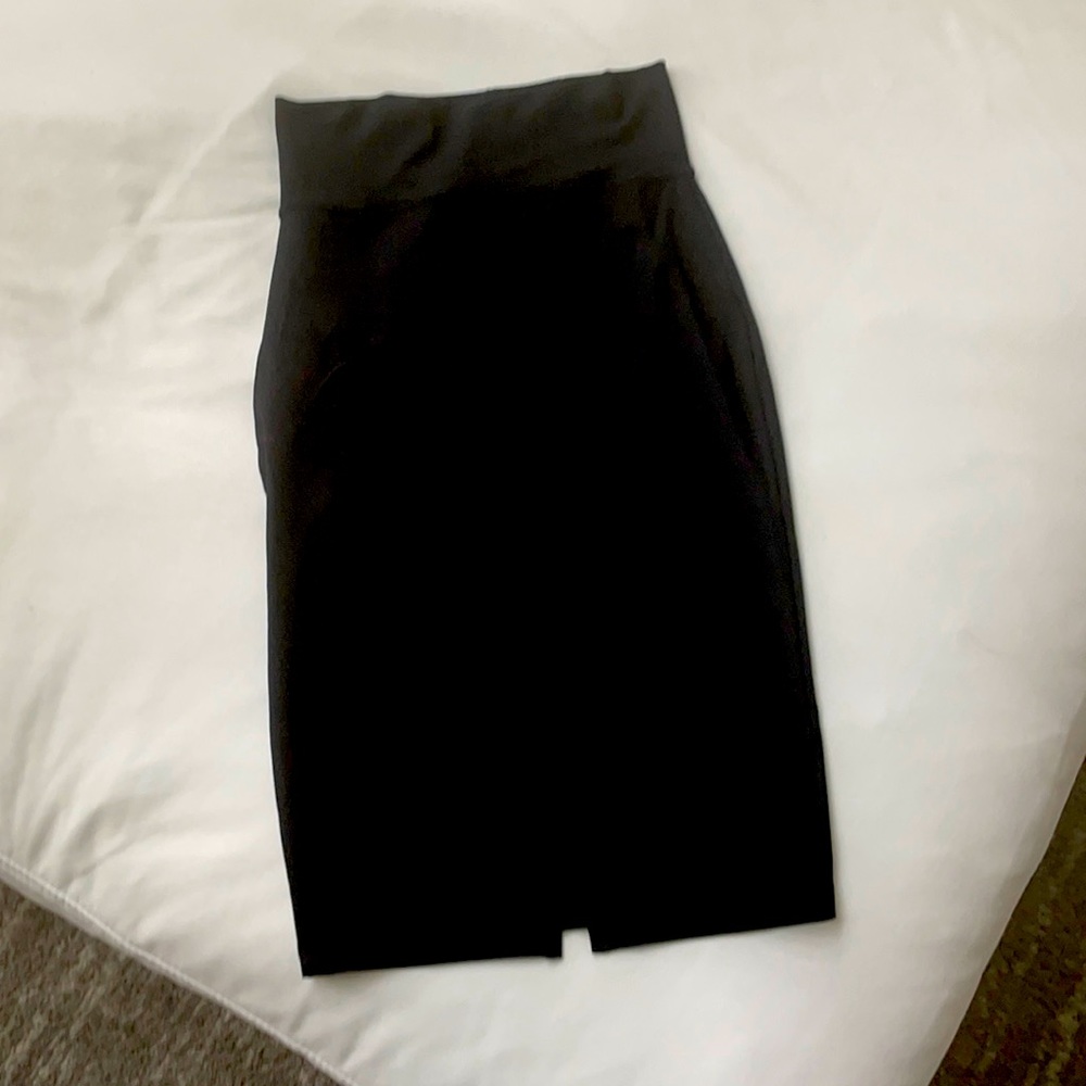 Bebe pencil skirt high waist. Like new, black with back slit.